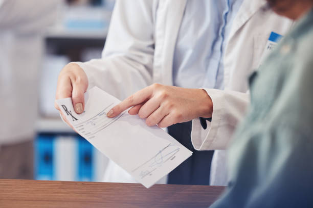 istock Customer help, paper and hands of pharmacist explain description, receipt information or healthcare advice. Store clinic client, hospital communication or closeup medical expert point at prescription 1676140058