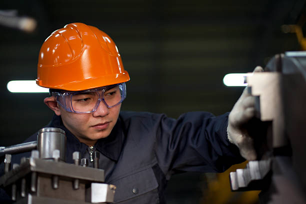 istock Technician in the factory working on a machine 167615336