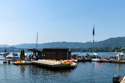 Zurich, Switzerland-May 27, 2023; Boat rental dock in Lake Zurich along the Seefeldquai against a blue sky