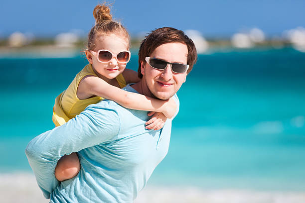 istock Father and daughter at beach 167615871