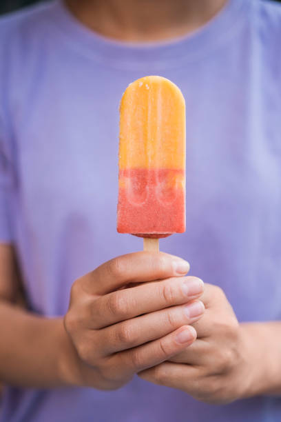 istock Hands holding colorful ice cream. Tasty dessert 1676161276