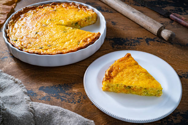istock Vegetables quiche slice on plate homemade on wooden rustic table 1676168475