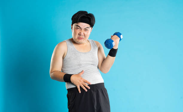 istock Image of Asian man exercising on blue background 1676169006
