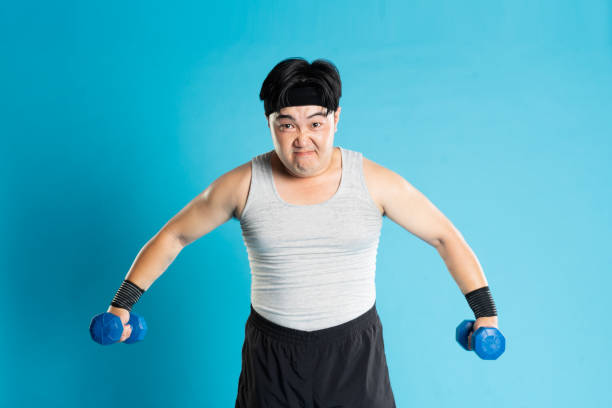 istock Image of Asian man exercising on blue background 1676170072