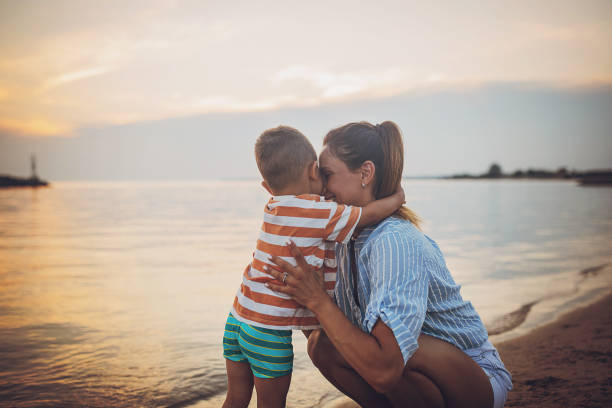 istock Mother with son on the beach 1676171192