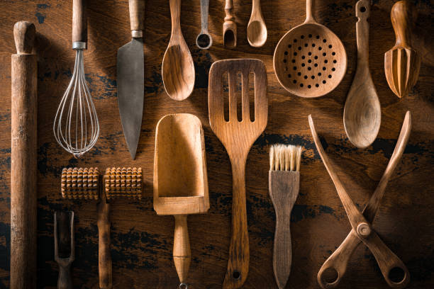 istock Wooden cutlery and kitchenware arrangement on rustic wood table board 1676176264