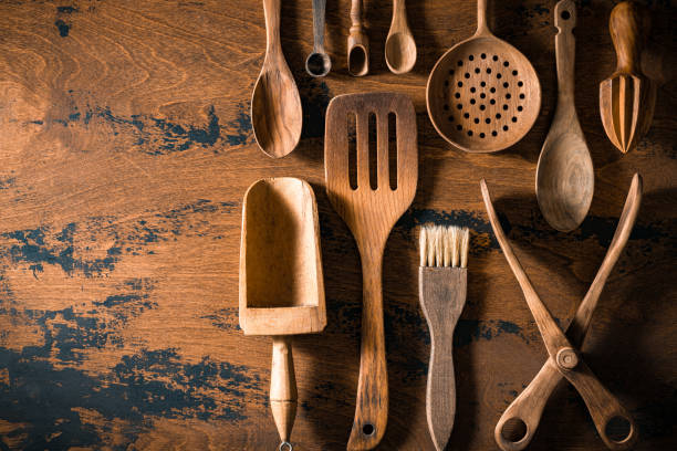 istock Wooden cutlery and kitchenware arrangement on rustic wood table board 1676182226