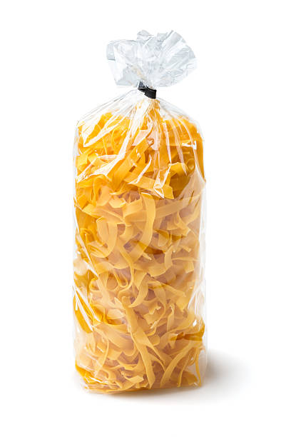 Pasta in a plastic bag on white background stock photo