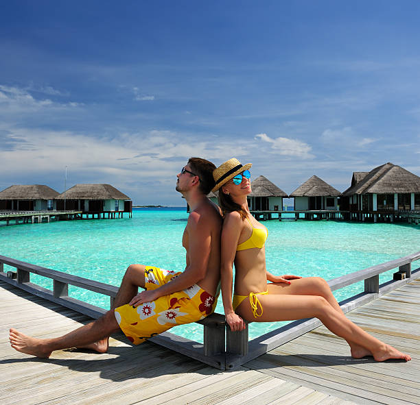 istock Couple on a beach jetty at Maldives 167619312
