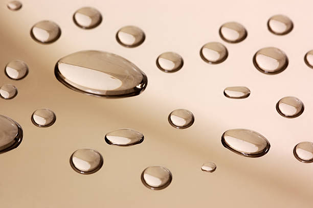 transparent droplets on the mirror surface stock photo