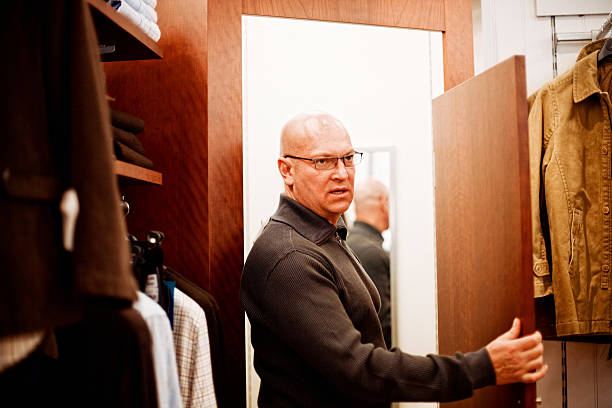 istock Bald Man in fitting room of a shop 167619706