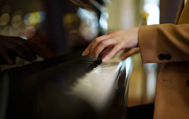 istock Female pianist plays the royal piano. 1676206814