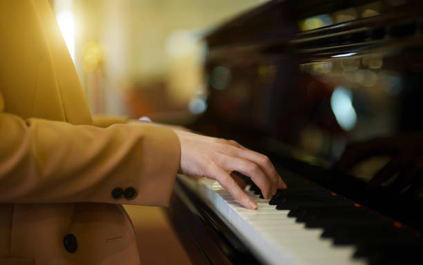 istock Female pianist plays the royal piano. 1676206822