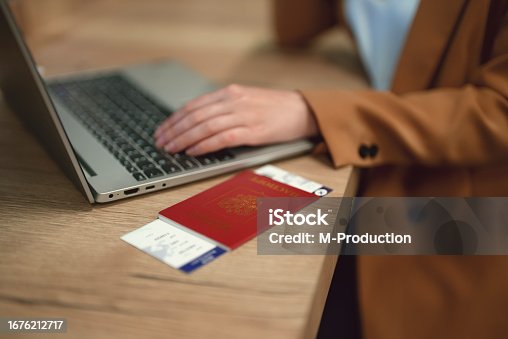 istock Woman with russian passport is waiting for her flight. 1676212717