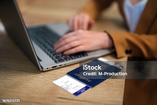 istock Woman with USA passport is waiting for her flight. 1676212721