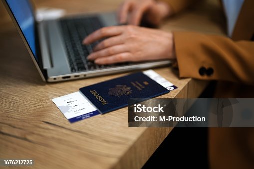 istock Woman with USA passport is waiting for her flight. 1676212725