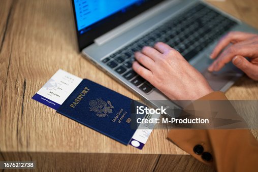 istock Woman with USA passport is waiting for her flight. 1676212738