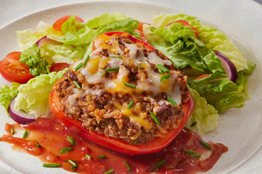 Italian Style Stuffed Peppers with Ground Beef, Rice, Tomato Sauce, Cheese and a Side Salad