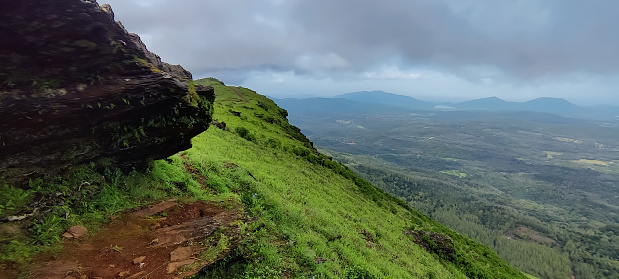 Amazing distant green valley view under the sky taken from tourist location Chikkamagaluru Karnataka India