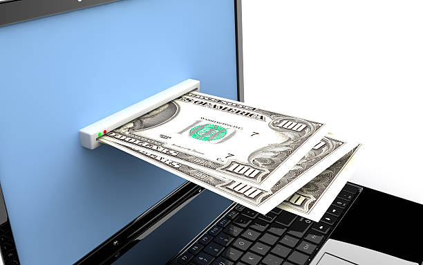 istock Laptop with money 167627124