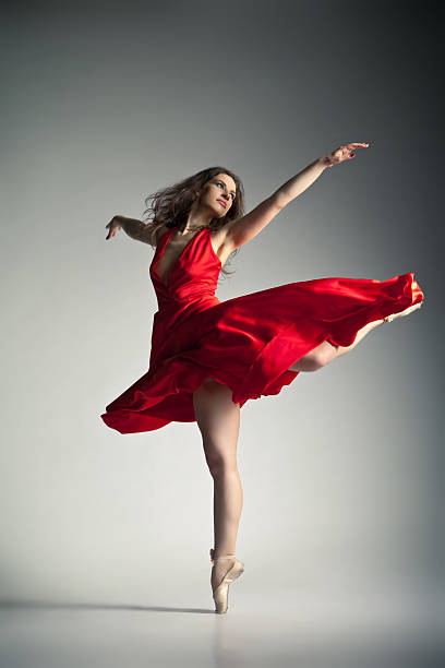 istock Ballet dancer wearing red dress over grey 167627659