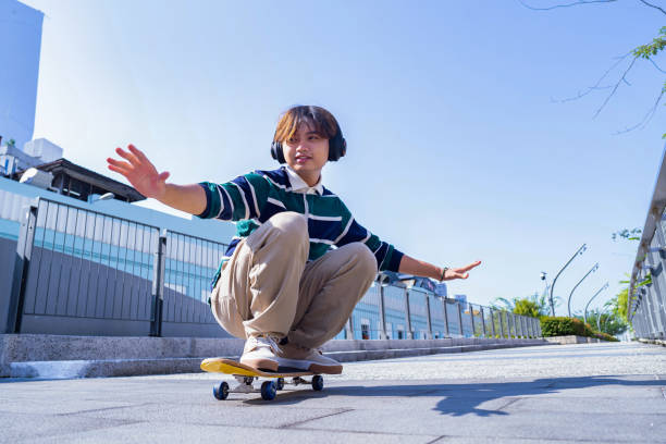 istock Young man with skateboard in the city on sunny day 1676294591