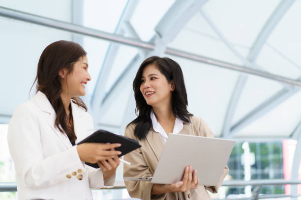 istock Asian businesswomen discussing - talking together. 1676301170