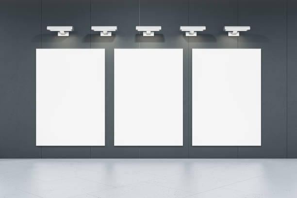 istock Modern concrete gallery interior with white mock up posters on wall. 3D Rendering. 1676308271