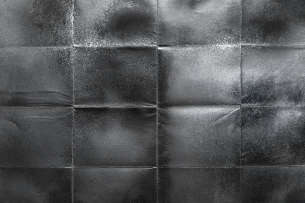 istock Silvery paper crumpled and stained, close-up 1676315017
