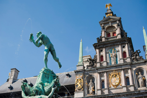 Statue of Silvius Brabo throwing a hand, on the Grand Market in Antwerp, Belgium.