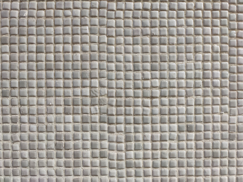 wall surface made of small white mosaics