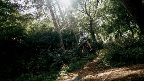 istock Man riding a mountain bike offroad 1676345596