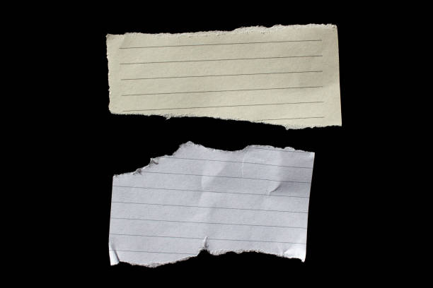 istock Torn paper piece isolated on a black background 1676361811