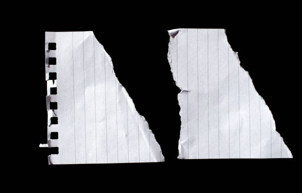 istock Torn paper piece isolated on a black background 1676362938