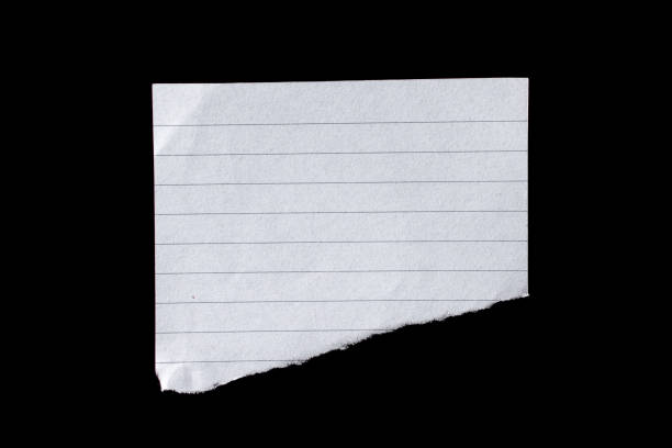 istock Torn paper piece isolated on a black background 1676364624