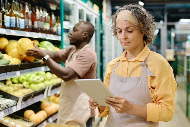 istock Saleswoman controlling goods online on tablet pc 1676366207