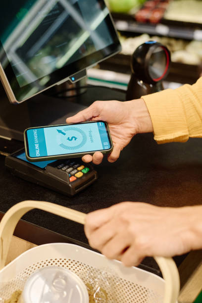 istock Customer paying with smartphone in supermarket 1676370363