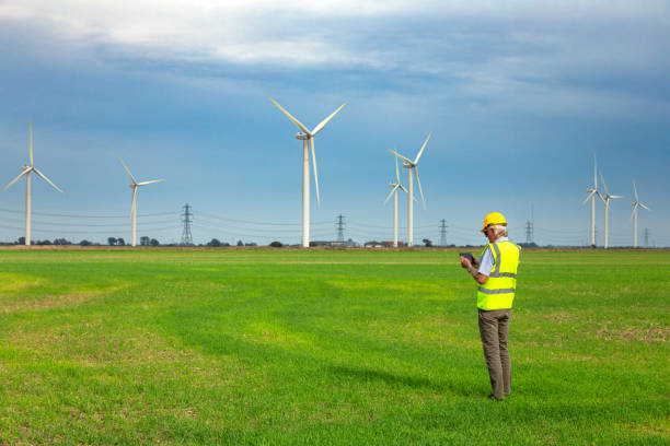 istock Maintenance engineer working at the wind farm checking on the turbines 1676410411