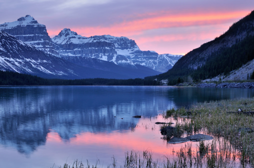 Twilight mountain landscape with reflection in Waterfowl Lake, Canadian Rokies, Banff National Park, Alberta, Canada