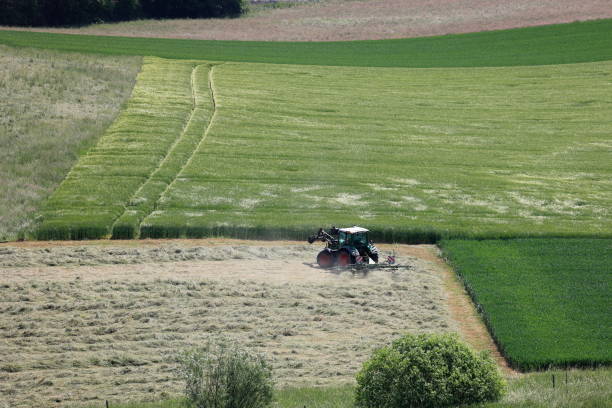 istock Agricultural vehicle at the hay harvest 1676428765