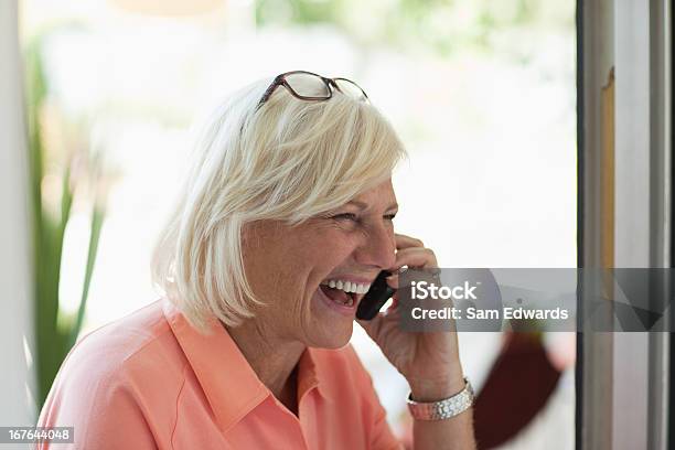 Older Woman Talking On Cell Phone Stock Photo - Download Image Now - 60-64 Years, Active Seniors, Adult