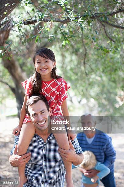 Father Carrying Daughter On His Shoulders Stock Photo - Download Image Now - 30-34 Years, 30-39 Years, 8-9 Years