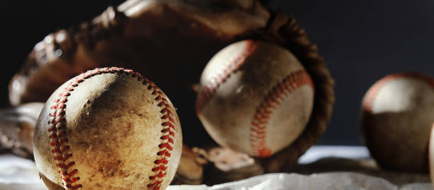 istock Old used baseballs in glove for sport 1676456024