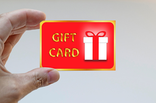 Hand holding a gift card
