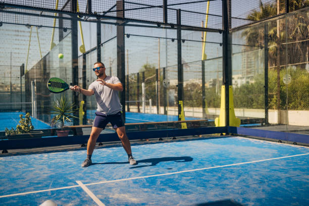 istock A male athlete plays paddle tennis, a sport that combines physical activity with fun. It is a great sport for players of all age groups and skills 1676473817