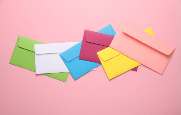 istock Set of colored envelopes on pink background. Creative layout 1676498325