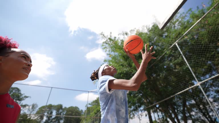 Women playing basketball