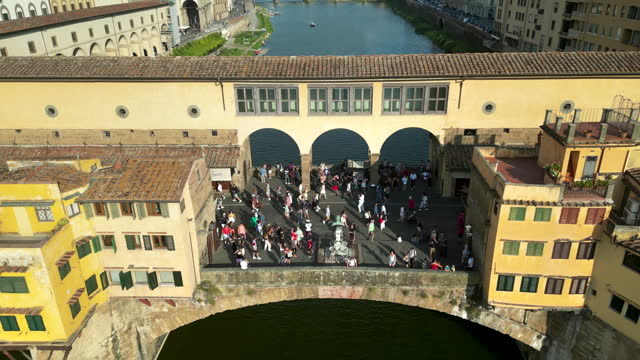 Aerial view of ponte vecchio bridge in Florence city, Florence bridge and river, Historically and Culturally Rich Italian Town Florence, Firenze - Aerial view of the city of Florence, Popular tourist destination in the world