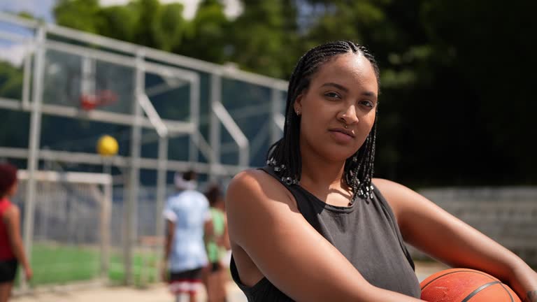 Portrait of a young woman in a sports court