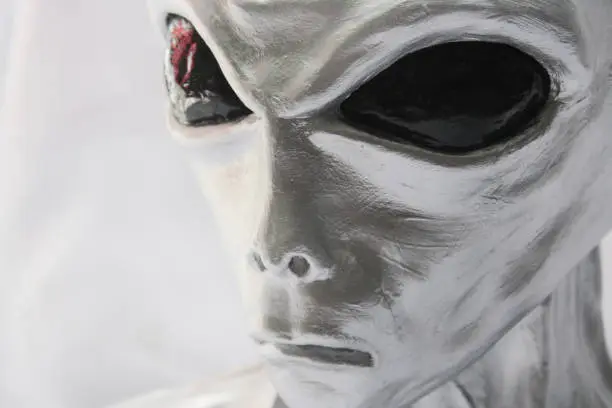 Photo of Alien face Sculpture. Portrait of extraterrestrial creature.